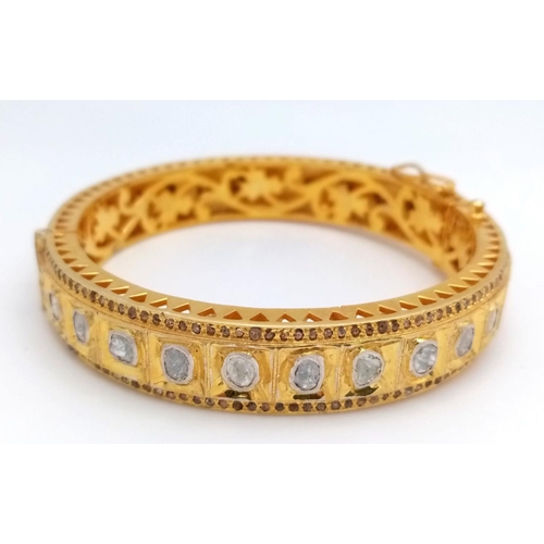 104 - An amazing, vintage, silver and gold bangle with old cut diamonds (totalling over 10.5 carats), inte... 