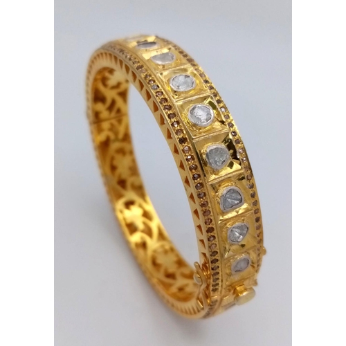 104 - An amazing, vintage, silver and gold bangle with old cut diamonds (totalling over 10.5 carats), inte... 