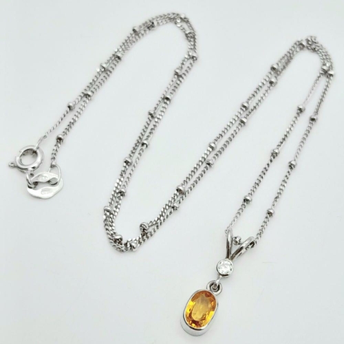 16 - An 18K White Gold Diamond and Citrine Necklace. 3.1g total weight. 0.03ct diamond weight. 40cm lengt... 