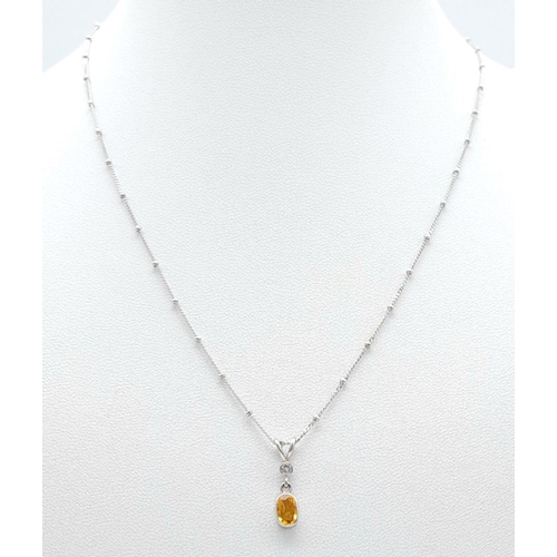 16 - An 18K White Gold Diamond and Citrine Necklace. 3.1g total weight. 0.03ct diamond weight. 40cm lengt... 