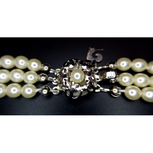 202 - A vintage and very glamorous PIERRE CARDIN three strand faux graduating white pearl chocker necklace... 