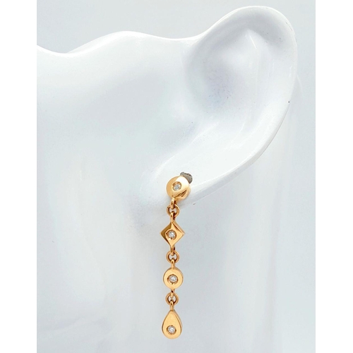 23 - A Pair of 18K Yellow Gold Diamond Drop Earrings. 4.5g total weight. 0.16ct diamond weight. JM16