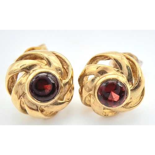 246 - A Pair of 9K Yellow Gold Garnet Fancy Stud Earrings. 2.3g total weight. JM11