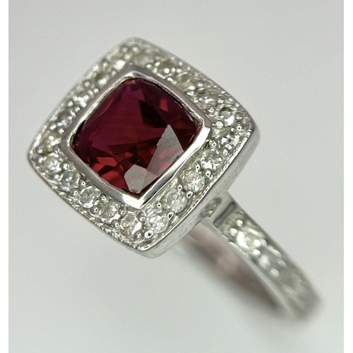 253 - A 9K White Gold (tested as) Diamond and Red Stone Ring, 2.5g total weight, 0.28ct diamond weight, si... 