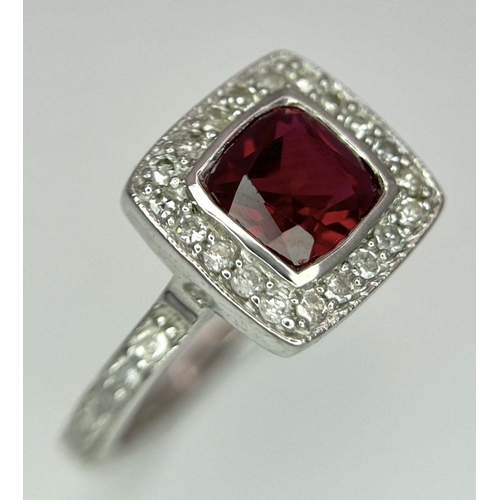 253 - A 9K White Gold (tested as) Diamond and Red Stone Ring, 2.5g total weight, 0.28ct diamond weight, si... 