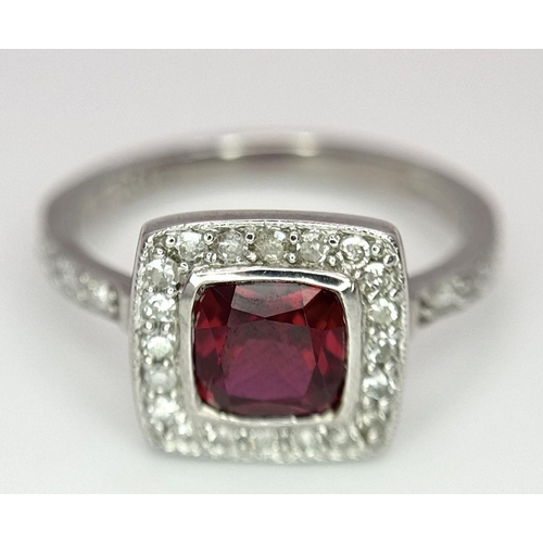 253 - A 9K White Gold (tested as) Diamond and Red Stone Ring, 2.5g total weight, 0.28ct diamond weight, si... 