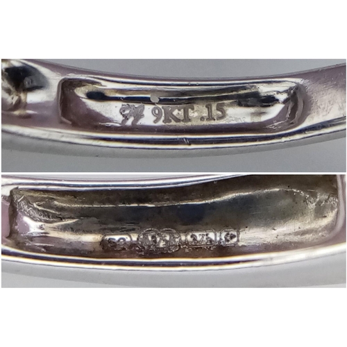 260 - A 9K White Gold (tested as) Half Eternity Ring. 1.6g total weight. 0.11ct diamond weight. Size I. Re... 