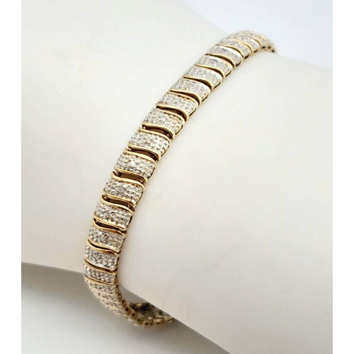 32 - A 9K Two-Tone Diamond Set Bracelet. 7.7g total weight. 0.26ct diamond weight. 20cm length. 7526H