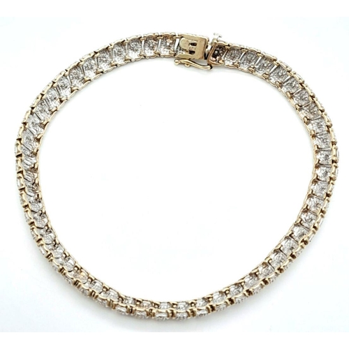 32 - A 9K Two-Tone Diamond Set Bracelet. 7.7g total weight. 0.26ct diamond weight. 20cm length. 7526H