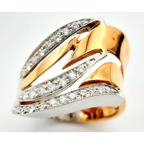 86 - A 14K Two-Tone Diamond Fancy Band Ring. 6.2g total weight. 0.14ct diamond weight. Size M. SH1603I