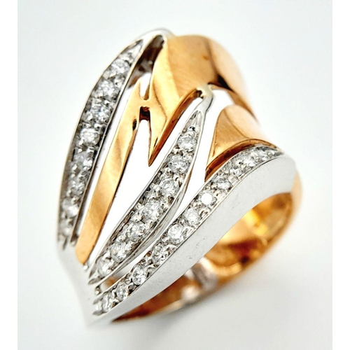 86 - A 14K Two-Tone Diamond Fancy Band Ring. 6.2g total weight. 0.14ct diamond weight. Size M. SH1603I