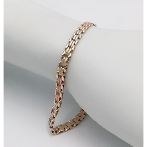 9 - A 9K Gold Three-Tone Intertwined Bracelet - 8.1g total weight. 20cm length. JM05