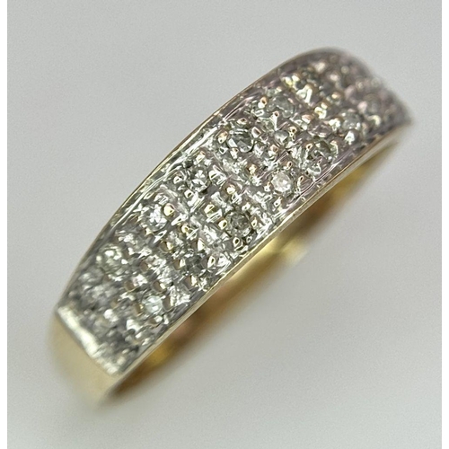 544 - A 9K YELLOW GOLD DIAMOND SET BAND RING - 2.1G. SIZE L. REF: SPAS 5007.