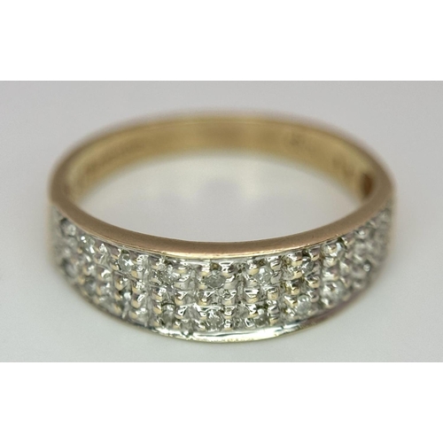 544 - A 9K YELLOW GOLD DIAMOND SET BAND RING - 2.1G. SIZE L. REF: SPAS 5007.