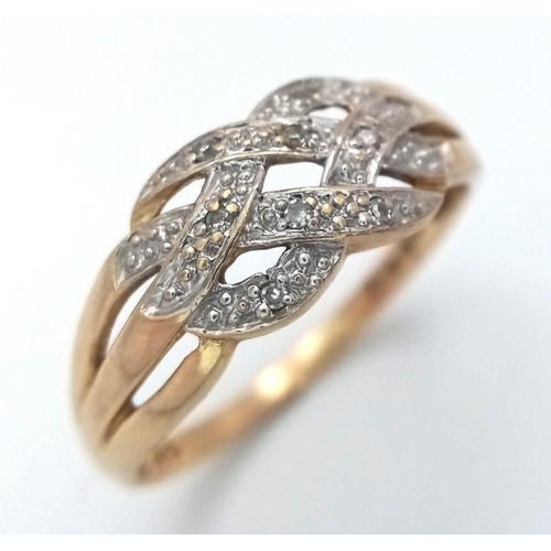 614 - A 9K YELLOW GOLD DIAMOND SET TWIST DESIGN RING -2.4G. SIZE U. REF: SPAS 5004