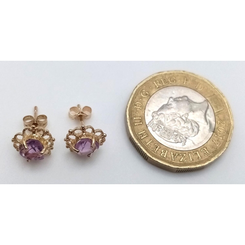 715 - A Pair of 9K Yellow Gold Amethyst Fancy Heart Stud Earrings. 1g total weight. JM19