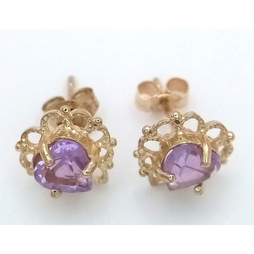 715 - A Pair of 9K Yellow Gold Amethyst Fancy Heart Stud Earrings. 1g total weight. JM19