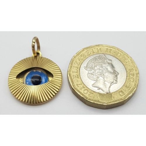 755 - A 9K YELLOW GOLD EVIL EYE PENDANT. 1.6G IN WEIGHT. 1.5CM IN DIAMETER. Ref: SC 5061.