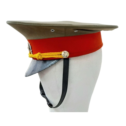 763 - Vietnam War Era Enlisted Mans NVA Visor Cap. Complete with badge and chin strap.