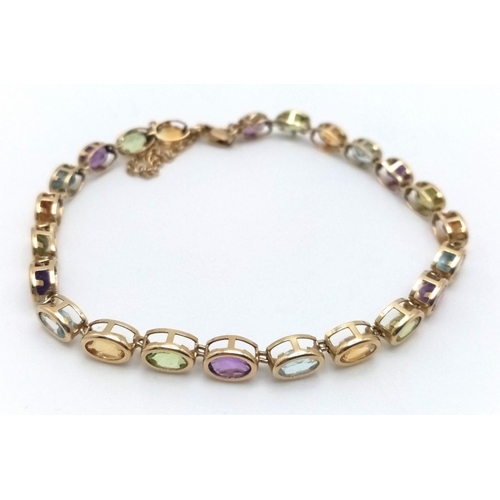 832 - A 9K YELLOW GOLD MULTI GEMSTONE SET BRACELET WITH SAFETY CHAIN. 6.45G IN WEIGHT. Ref: SC 5069.