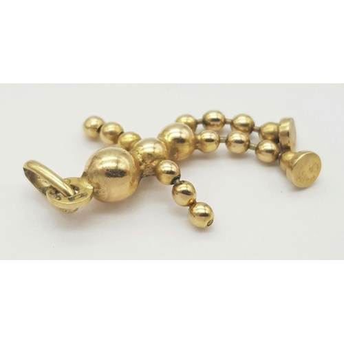 958 - A 9K YELLOW GOLD ARTICULATED BALL BEADED PERSON 1.7G. Ref: SC 5012.