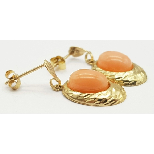 189 - Beautiful pair of 9 carat GOLD EARRINGS. Drop style set with polished CORAL AGATE. Complete with 9 c... 