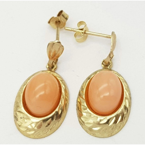 189 - Beautiful pair of 9 carat GOLD EARRINGS. Drop style set with polished CORAL AGATE. Complete with 9 c... 