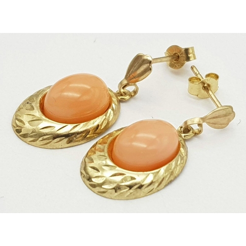 189 - Beautiful pair of 9 carat GOLD EARRINGS. Drop style set with polished CORAL AGATE. Complete with 9 c... 