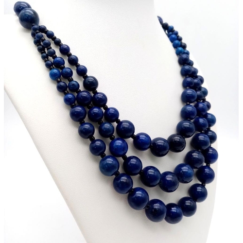 195 - A vintage, three strand necklace and bracelet set with round lapis lazuli beads of graduating size. ... 