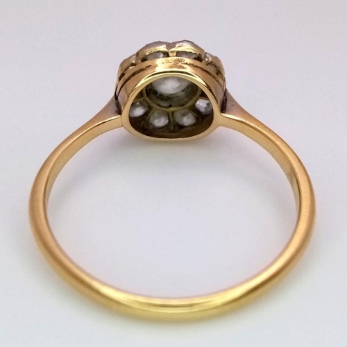 470 - An 18K Yellow Gold and Diamond Ring. Central diamond with a diamond halo. Size N. 2.3g total weight.