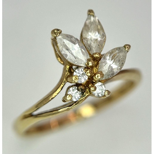 477 - A 9K Yellow Gold Decorative Floral White Zircon Ring. Size J. 1.6g.