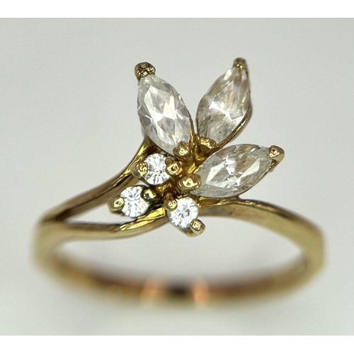 477 - A 9K Yellow Gold Decorative Floral White Zircon Ring. Size J. 1.6g.