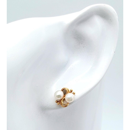 491 - A Pair of 9K Yellow Gold Pearl Fancy Stud Earrings. 1.6g total weight. Ref: JM14