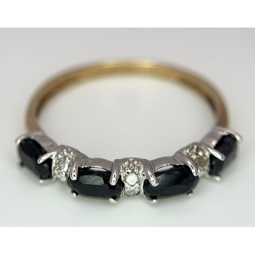 463 - A 9K Yellow Gold Onyx and Diamond Ring. Size P. 1.5g total weight.