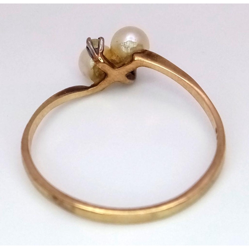 478 - A 9K Yellow Gold Diamond and Pearl Ring. 1.2g total weight. 0.04ct diamond weight. Size O. JM10.