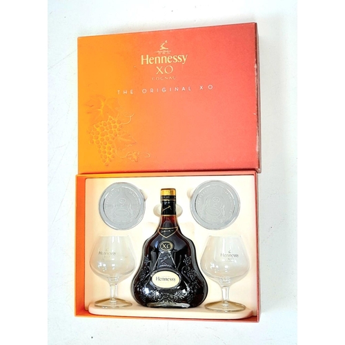 485 - A Hennessy X.O  Cognac Gift Set. Includes a bottle of X.O Hennessy (70cl)- Two branded Cognac Glasse... 