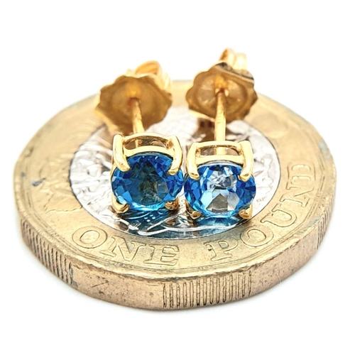 499 - A Pair of 18K Yellow Gold Topaz Solitaire Studs. 1.1g total weight. JM17.