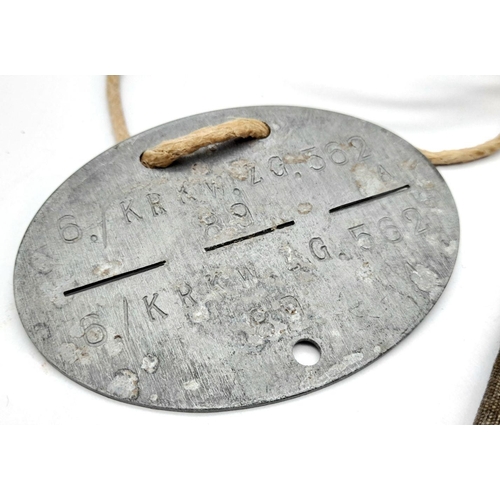 545 - WW2 German Army Dog Tag for an Infantry Driver. The tag comes in a home-made pouch.