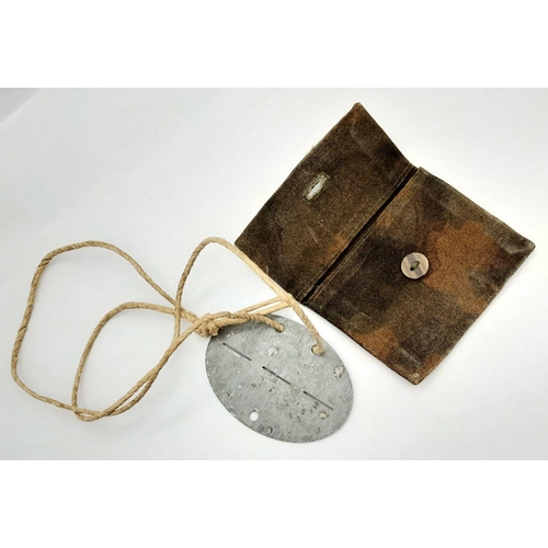 545 - WW2 German Army Dog Tag for an Infantry Driver. The tag comes in a home-made pouch.