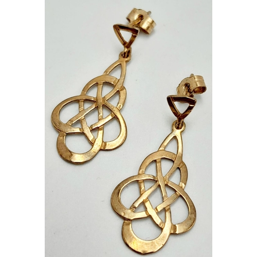 588 - Attractive pair of  9 carat GOLD CELTIC EARRINGS. Drop style with filigree Celtic design. Complete w... 