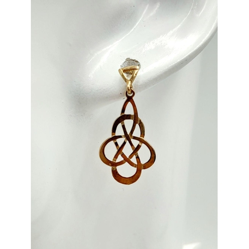 588 - Attractive pair of  9 carat GOLD CELTIC EARRINGS. Drop style with filigree Celtic design. Complete w... 