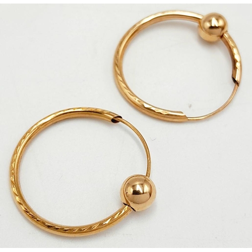 609 - Classic pair of 9 carat GOLD HOOP EARRINGS with sliding GOLD BALL detail. 0.62 grams. 2 cm diameter.... 