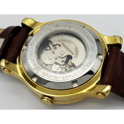 727 - An Ingersoll Automatic Stone Set Ladies Watch. Brown leather strap. Gilded stone set case - 34mm. Br... 