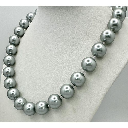 913 - A Metallic Silver South Sea Pearl Shell Bead Necklace. 14mm beads. 44cm necklace length.