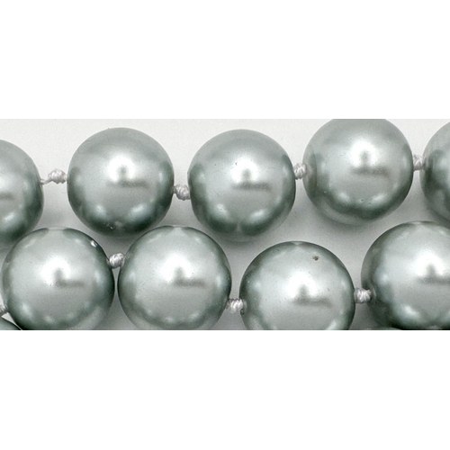 913 - A Metallic Silver South Sea Pearl Shell Bead Necklace. 14mm beads. 44cm necklace length.