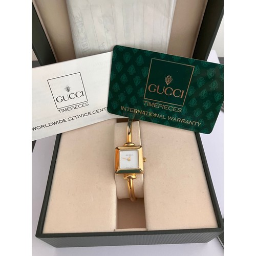 105 - Genuine Vintage GUCCI 1900L LADIES WRISTWATCH. 18 carat gold plated. Complete with original case, re... 