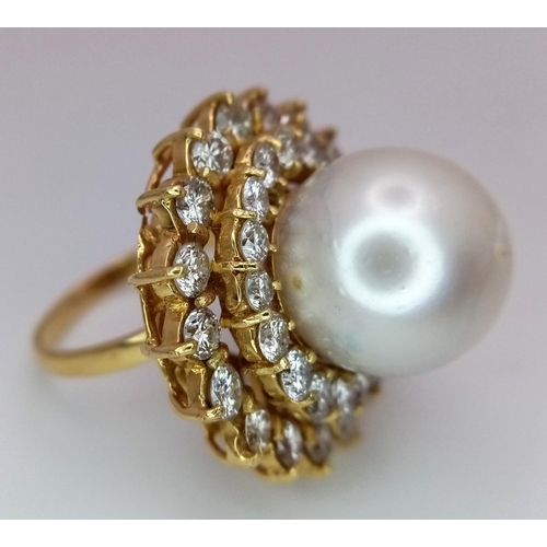 12 - A stunning 18 K yellow gold ring with a large perfectly spherical white natural pearl, 14 mm in diam... 