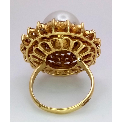 12 - A stunning 18 K yellow gold ring with a large perfectly spherical white natural pearl, 14 mm in diam... 