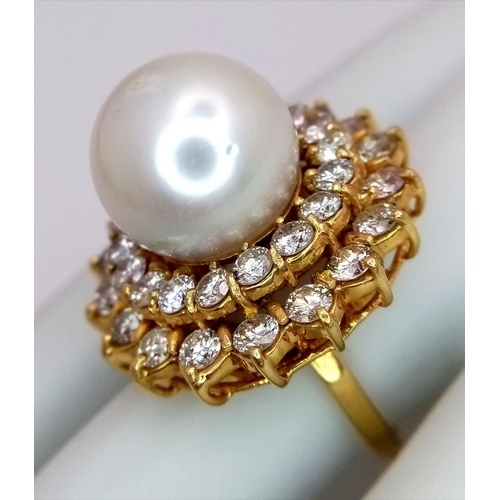 12 - A stunning 18 K yellow gold ring with a large perfectly spherical white natural pearl, 14 mm in diam... 