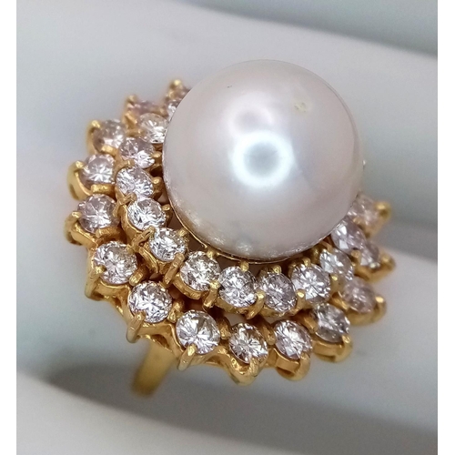 12 - A stunning 18 K yellow gold ring with a large perfectly spherical white natural pearl, 14 mm in diam... 